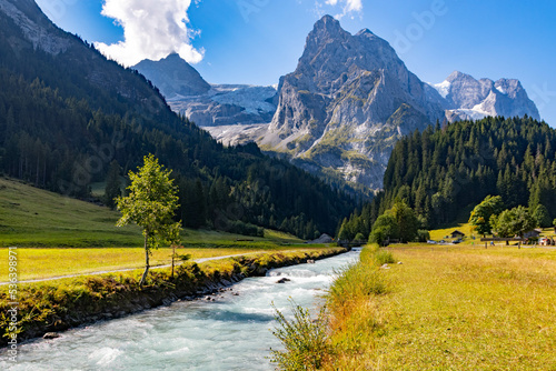 Rychenbach river in Meiringen, Bern, Switzerland. This river gets its water from the Rosenlaui Glacier. Photo taken in Reichenbachtal valley photo