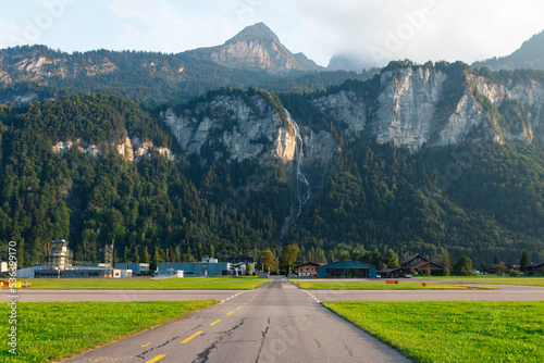 Oltschibachfall seen from Meiringen Airport in Switzerland. This waterfall is located in Meiringen, in the Swiss canton of Bern. photo