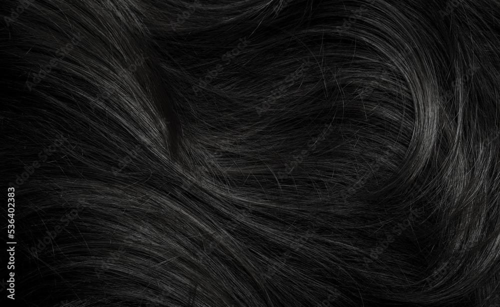Naklejka premium Brunette or black hair. Female long dark hair in black. Beautifully laid curls. Closeup texture in a dark key. Hairdressing, hair care and coloring. Shading gray hair. Background with copy space.
