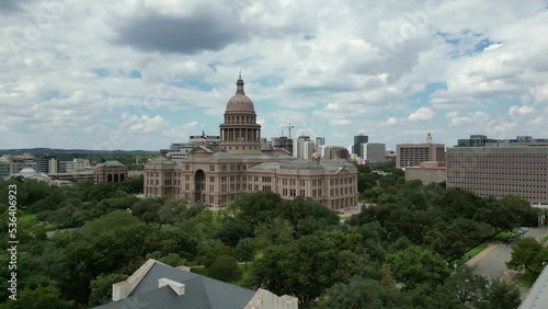 View of the Texas State Capitol from the drone surrounded by green trees. Austin, USA. photo