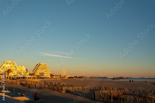 Scenic view of the La Grande Motte by the shore of the beach during sunset photo