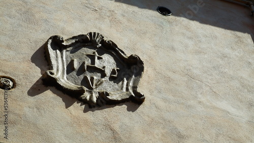 IHS coat of arms on ancient palaces, is a nomen sacrum that since the Middle Ages has a use in the figurative art of the Catholic Church as a Cristogramma photo