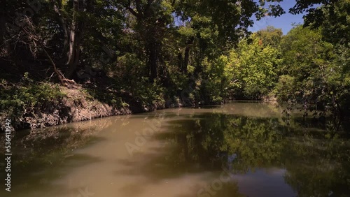 Rowlette Creek Preserve isin the deep woods of Allen, Texas surrounded by trees photo