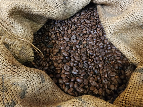 Brown coffee beans in burlap sack © PixieMe