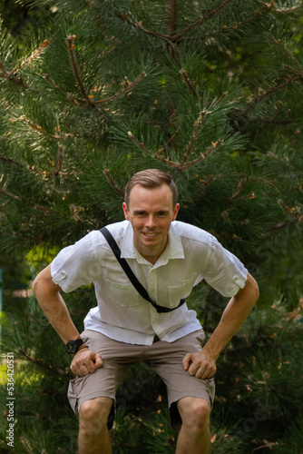 Young man having fun on a walk in the park © RedJake