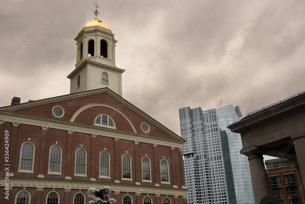 View of Boston's famous Faneuil Hall with a modern skyscraper in the background