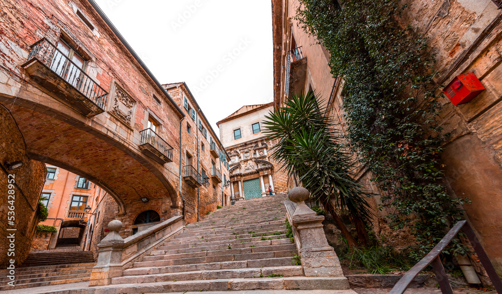 Beautiful steps and archway of the Pujada de Sant Domenec located in the Jewish Quarter of Girona, Spain