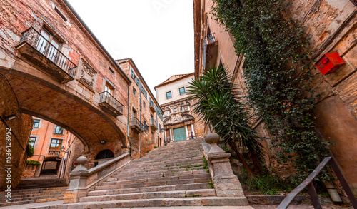 Beautiful steps and archway of the Pujada de Sant Domenec located in the Jewish Quarter of Girona, Spain photo