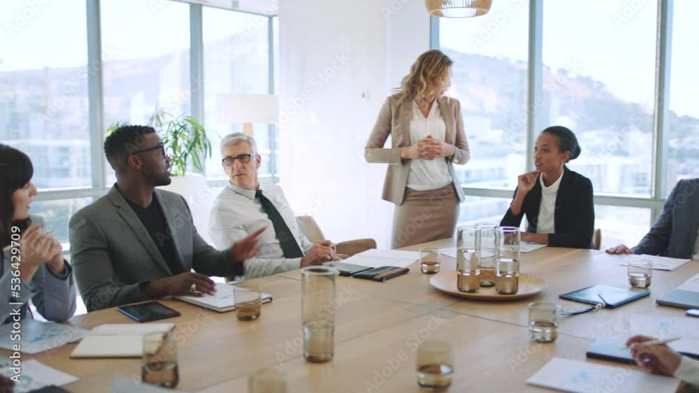 Presentation, training and learning workshop in an office with a business woman talking to her team during a meeting. Teamwork, strategy and collaboration with a group of people planning and working