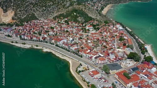 A city on the shore of a large lake photo