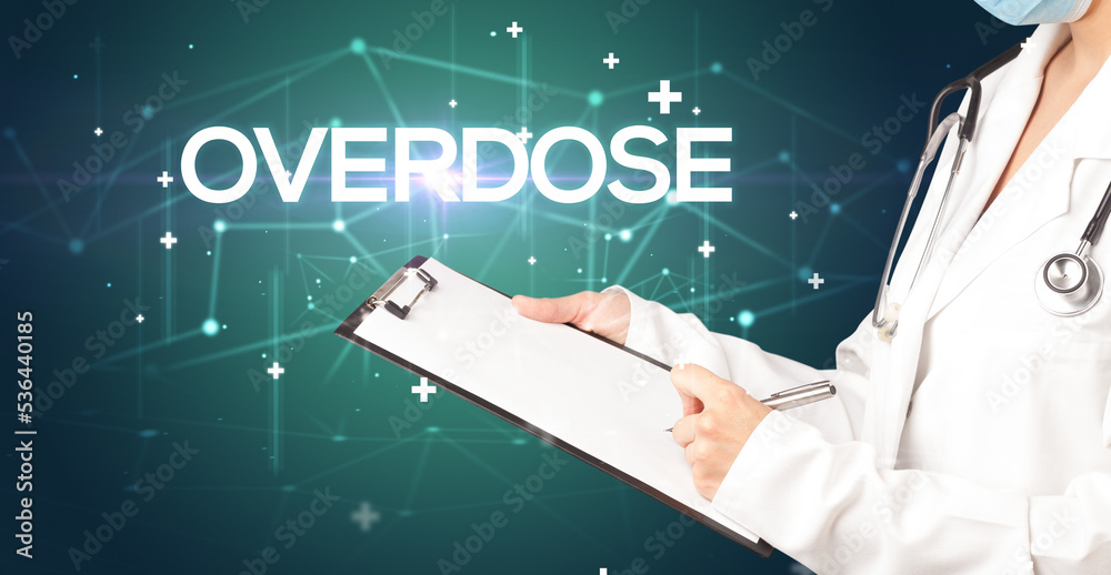 Doctor fills out medical record Doctor fills out medical record
