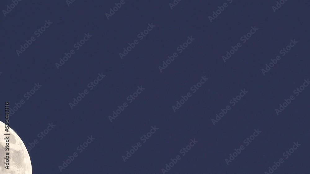 moon rising. telephoto lens real shot with flickering atmosphere. speeded up