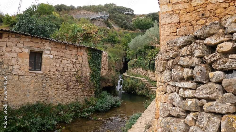 path along the Molinar river going to waterfall #1 in Tobera village, municipality of Frías, province of Burgos, Castile and León, Spain path along the Molinar river going to waterfall #1 in Tobera village, municipality of Frías, province of Burgos, Castile and León, Spain