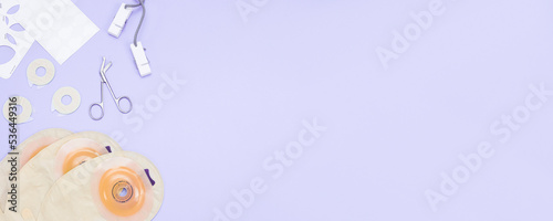 Set of colostomy bag on a soft lilac background. photo