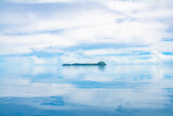 View of Ulong island, sky reflection in ocean, Rock Islands Southern Lagoon, Koror state, Palau, Pacific