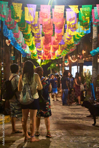 people in street with ornaments at night in sayulita nayarit