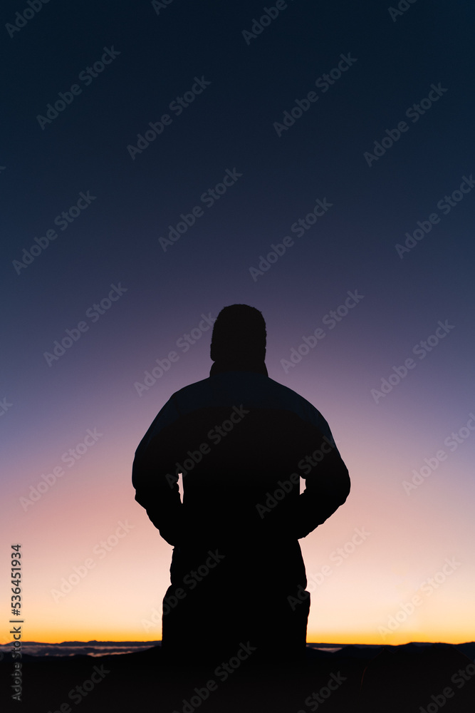 silhouette of a person in the sunrise