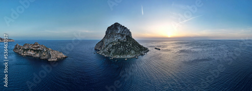 Aerial panoramic view of Es Vedra Ibiza during sunset. Showing ocean and clear skies. photo