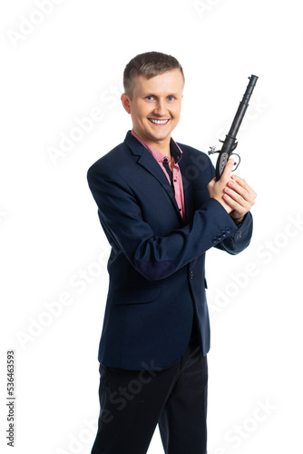 man in a blue business suit with a gun. builder, engineer, foreman, boss, rukuvatel, businessman. man hits the target. successful, armed man. isolated © Ольга Новицкая