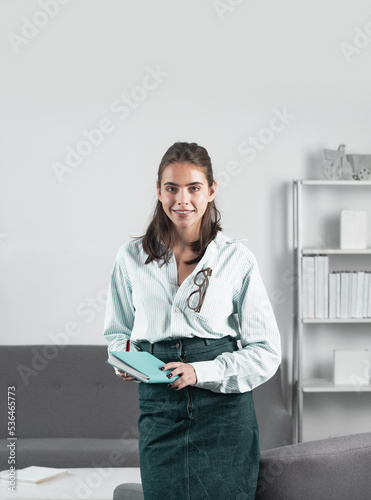 Female student or young teacher girl. Business woman entrepreneur working in office, professional employee at workplace. Young beautiful secretary girl.