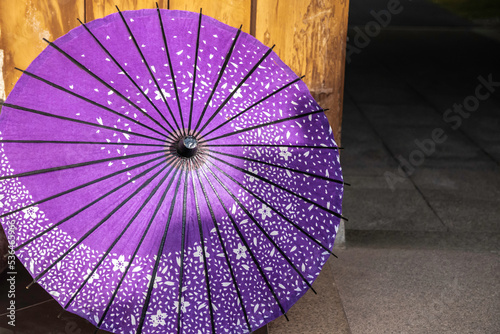 pink fan on a wooden background