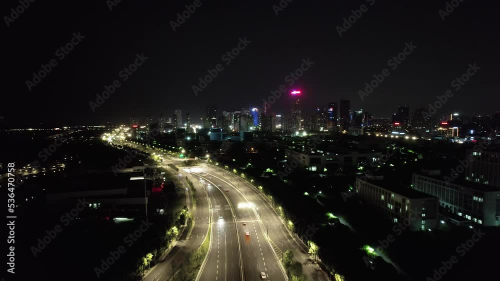 aerial view of elevated road and cityscape of modern city at twilight