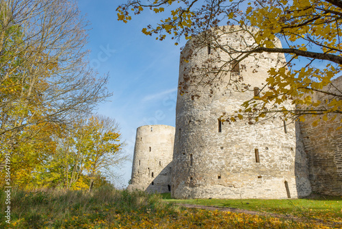 Sunny October day at the ancient towers of the Izborsk fortress. Pskov region, Russia photo