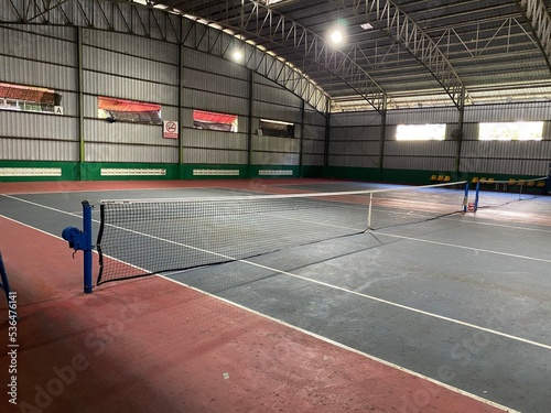 empty tennis court indoor for practice and tennis match
