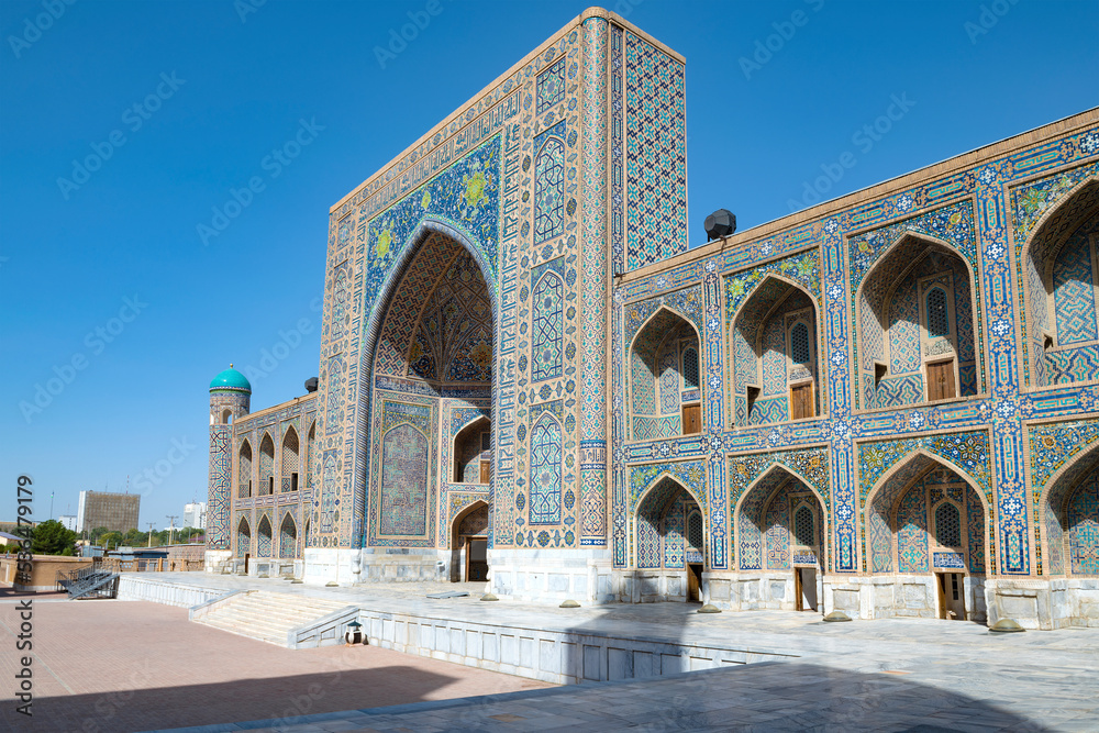 At the ancient Tilla-Kari Madrasah (1660) on a sunny day. Registan Square. Samarkand, Uzbekistan