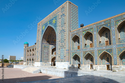 At the ancient Tilla-Kari Madrasah (1660) on a sunny day. Registan Square. Samarkand, Uzbekistan