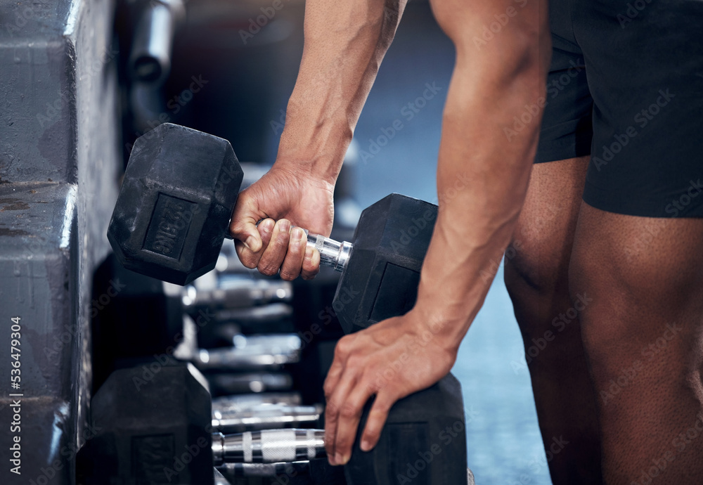 Closeup of man, workout and hands weightlifting with dumbbell in gym for health, fitness and muscle development. Strong, bodybuilder and exercise for sports, wellness and motivation in training club Closeup of man, workout and hands weightlifting with dumbbell in gym for health, fitness and muscle development. Strong, bodybuilder and exercise for sports, wellness and motivation in training club