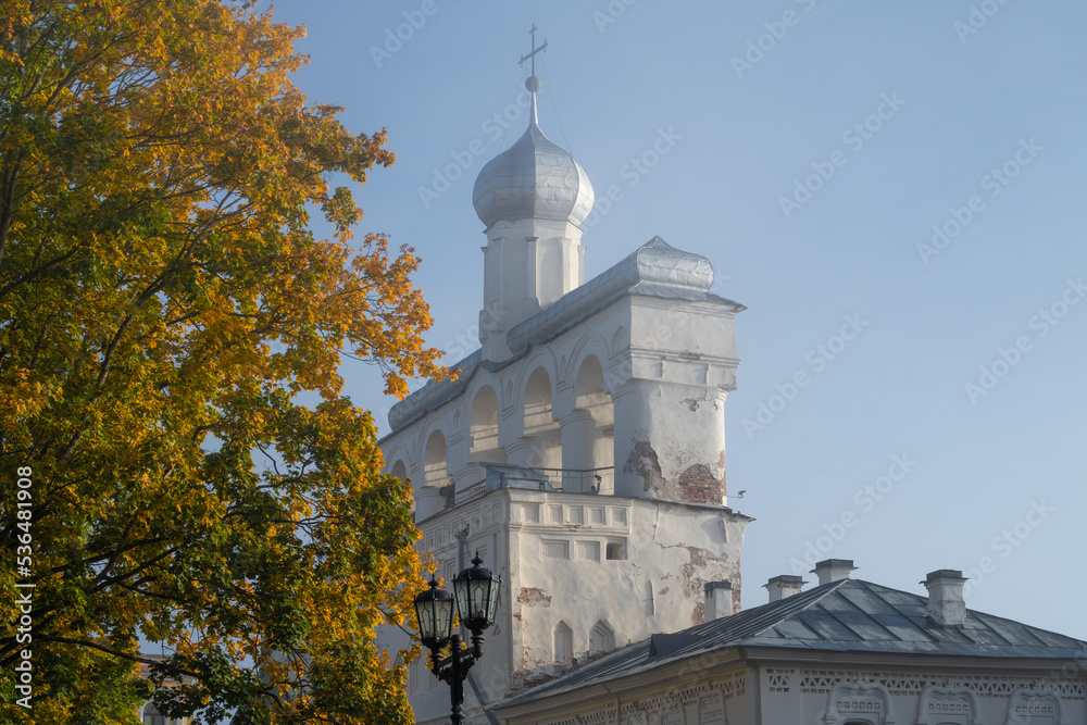 Ancient belfry of St. Sophia Cathedral in October morning fog. Kremlin of Veliky Novgorod. Russia