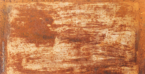 Recycled Materials - Sheet metal filled with orange-brown rust and scratches..
