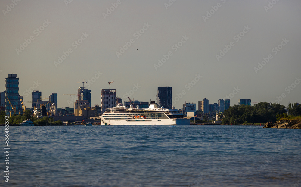 Fototapeta premium A luxury cruise ship docks in port at sunset. Passenger vessel Travels