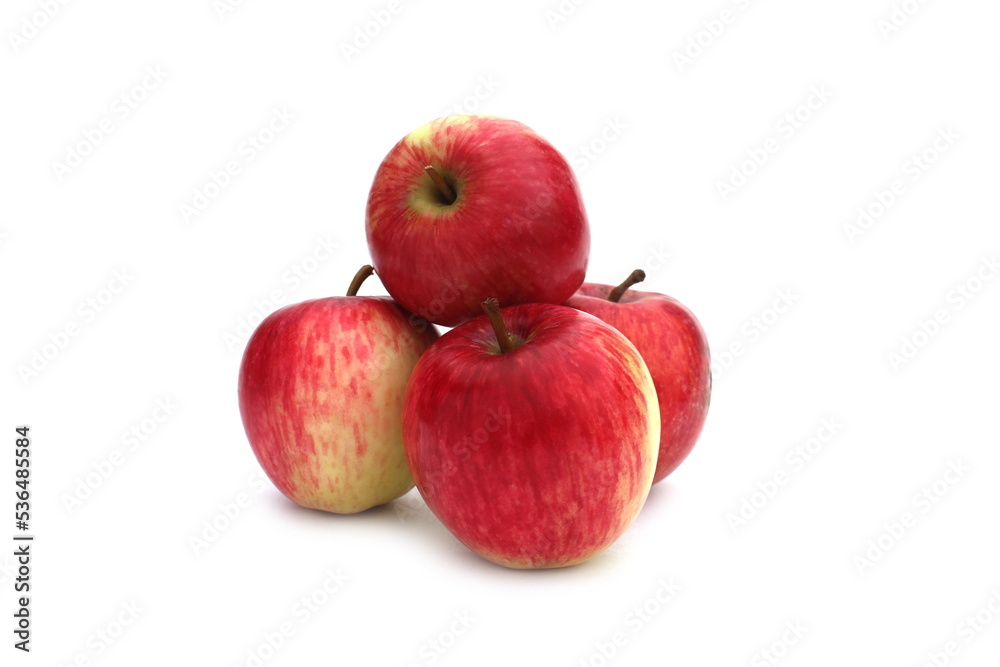A bunch of red apples lies on a white background. A bunch of red apples lies on a white background.