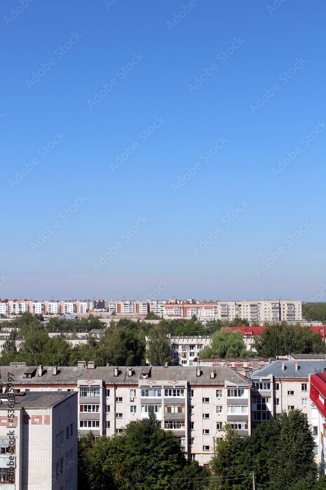 View of the summer city from a height on a clear sunny summer day.