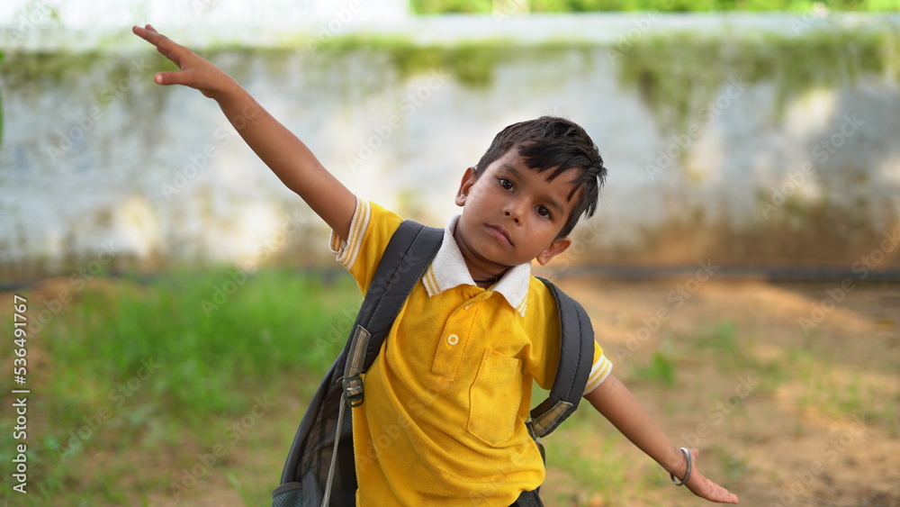 Happy smiling indian school kid in school uniform. Portrait of smart