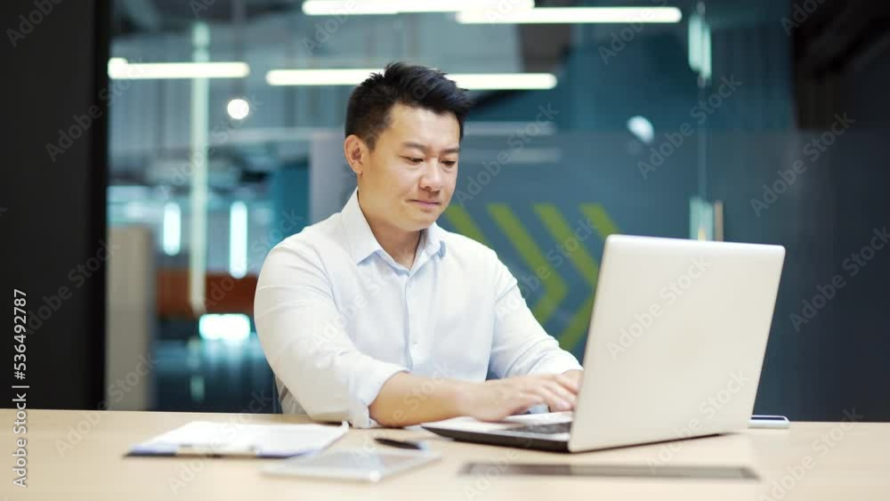 Difficulties are problem working with software on a laptop business man employee entrepreneur office worker or accountant in workplace at computer desk. dissatisfied, unhappy with the service mistake Difficulties are problem working with software on a laptop business man employee entrepreneur office worker or accountant in workplace at computer desk. dissatisfied, unhappy with the service mistake