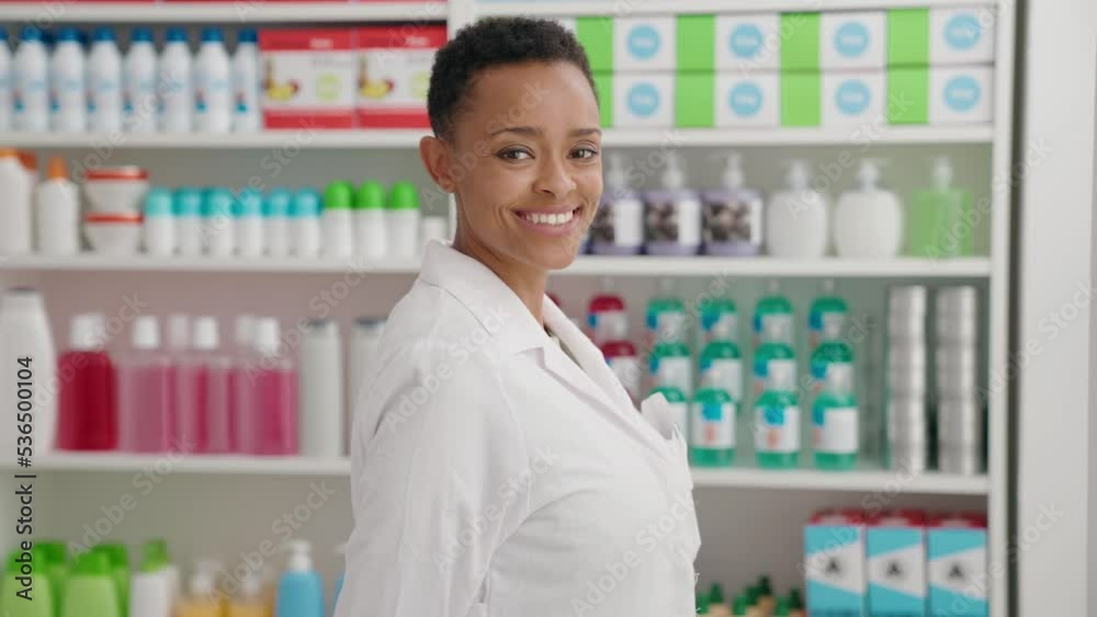African american woman pharmacist smiling confident standing at pharmacy African american woman pharmacist smiling confident standing at pharmacy