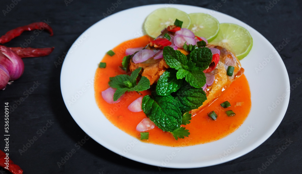 Canned fish salad on a dark background. Select focus. Canned fish salad on a dark background. Select focus.