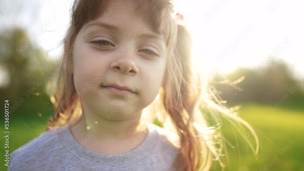 people in the park. portrait little girl outdoors. sun happy family kid dream concept. child a girl kid portrait close-up in the park glare. happy cute baby in summer outdoors close up portrait people in the park. portrait little girl outdoors. sun happy family kid dream concept. child a girl kid portrait close-up in the park glare. happy cute baby in summer outdoors close up portrait