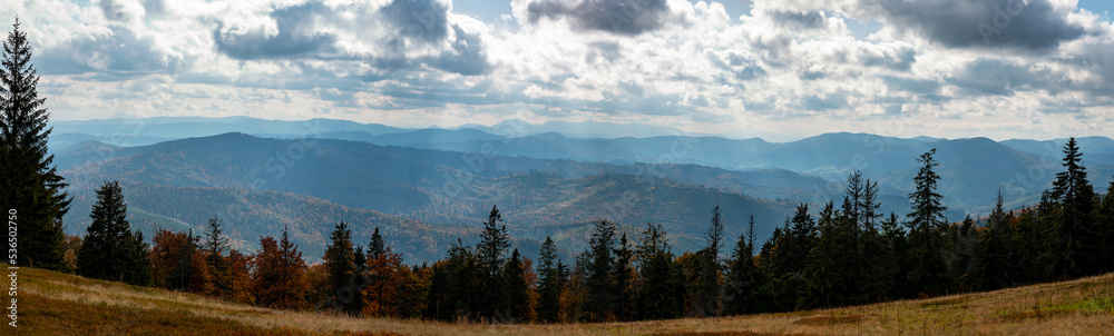 Beautiful autumn mountain panorama of the Beskids. Descent from  Lipowska hall to the village of Złatna