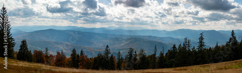 Beautiful autumn mountain panorama of the Beskids. Descent from Lipowska hall to the village of Złatna