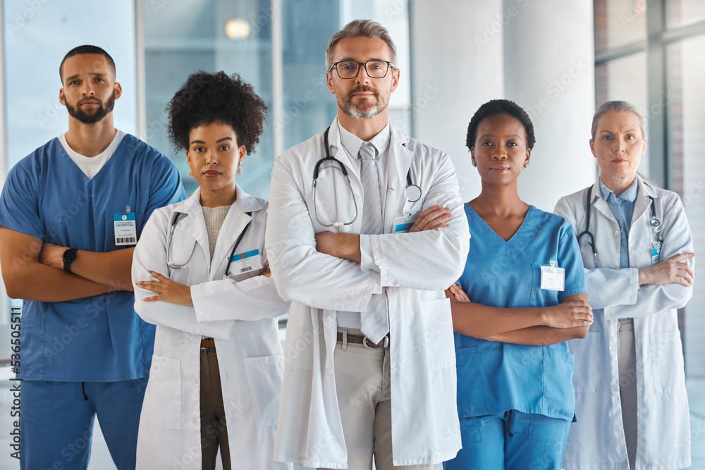 Doctors, nurses and team portrait in hospital, clinic or medical office. Diversity, health and healthcare professionals standing together arms crossed in confidence teamwork, collaboration or support Doctors, nurses and team portrait in hospital, clinic or medical office. Diversity, health and healthcare professionals standing together arms crossed in confidence teamwork, collaboration or support