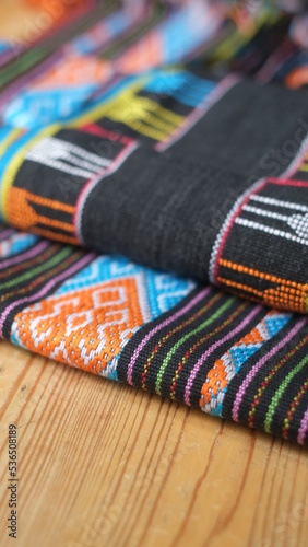 Pile of woven fabrics from East Nusa Tenggara Indonesia © Dennis
