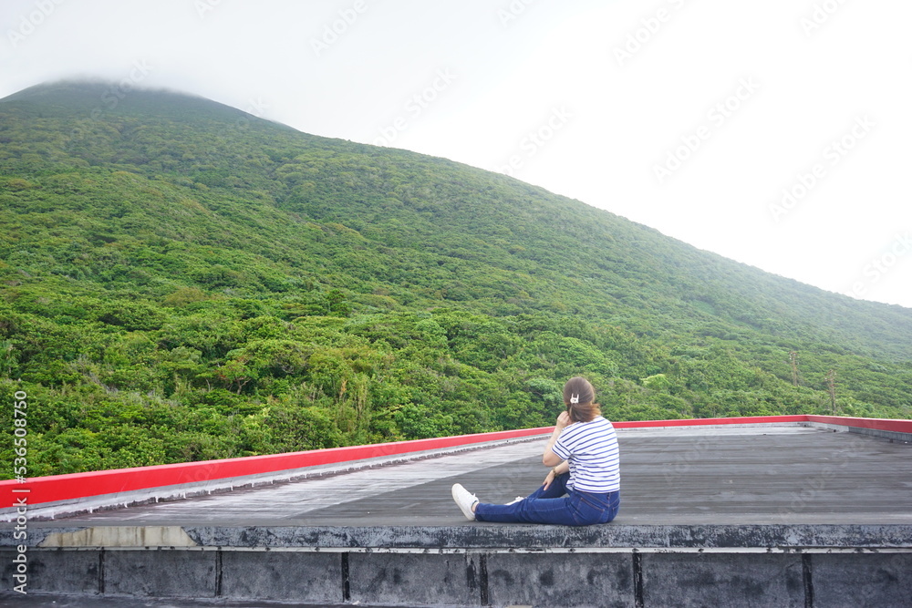 Woman standing at Kasarizaki in Amami Oshima, Kagoshima, Japan - 日本 鹿児島県 奄美大島 笠利崎 観光客 女性 Woman standing at Kasarizaki in Amami Oshima, Kagoshima, Japan - 日本 鹿児島県 奄美大島 笠利崎 観光客 女性