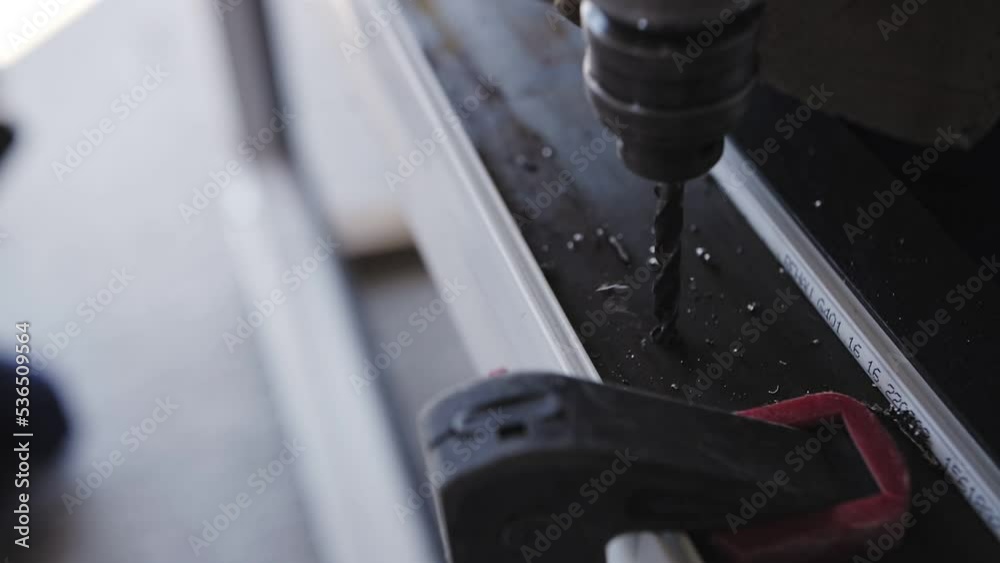 builder drills with drill, drill bit close-up