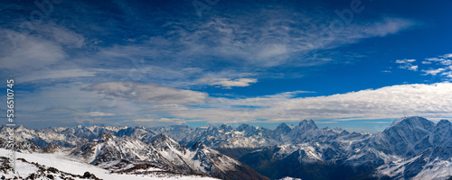 Panorama of winter mountain landscape with rocks and snow. Caucasus