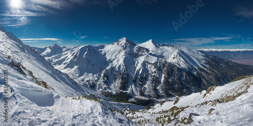 Panoramic landscape of Vihren and Kutelo peaks in sunny winter day. Observation deck at Todorka peak in the Pirin Mountains near Bansko, Bulgaria.