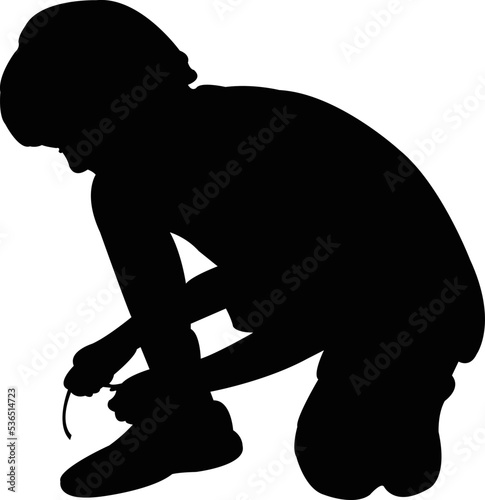 a boy tying shoes laces, silhouette vector